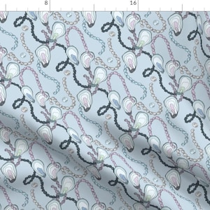 May include: A seamless pattern featuring a repeating design of blue, pink, and green oyster shells with pearl necklaces on a light blue background.