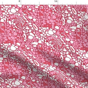 May include: A seamless pattern featuring a pink and white abstract design. The pattern resembles a close-up of cells or organic tissue.