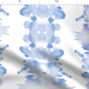 May include: A seamless pattern featuring a repeating design of blue watercolor splotches on a white background.