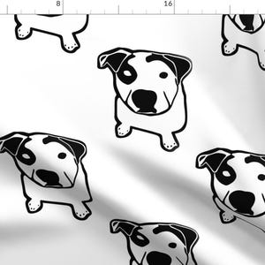 Puede incluir: Patrón repetido en blanco y negro de la cara de un perro. El perro tiene la cara blanca con manchas negras y la nariz negra.