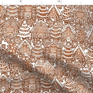 May include: A repeating pattern of gingerbread houses and Christmas trees in shades of brown and white. The design features detailed icing decorations on the houses and trees, creating a festive holiday theme.