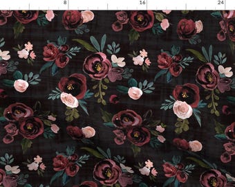 May include: Dark fabric with a floral pattern. The design features clusters of burgundy and blush roses, accented by small white flowers and green leaves. The background is a dark, textured charcoal color.