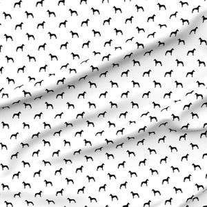 May include: A white fabric with a repeating pattern of black dog silhouettes.