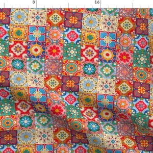 May include: A colorful patchwork pattern with a variety of geometric shapes and floral designs in shades of red, blue, green, yellow, and white.