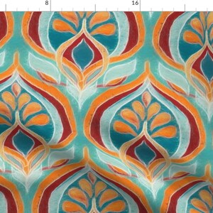 May include: A teal, orange, red, and white patterned fabric with a repeating design of stylized floral shapes.