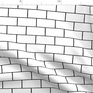 以下が含まれることがあります： 黒の目地が入った白いレンガ模様。模様は画像全体に繰り返されています。