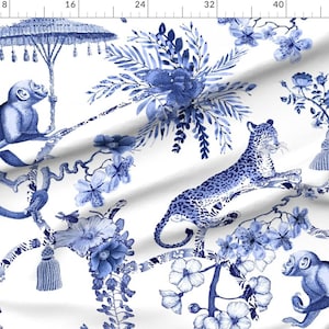 May include: Blue and white fabric with a repeating pattern of monkeys, leopards, flowers, and branches. The pattern is reminiscent of traditional Chinese porcelain.