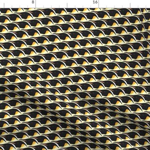 May include: A repeating pattern of black, white, and gold curved shapes. The design has a textured appearance, with each shape resembling a stylized feather or wave. The overall effect is a visually dynamic and abstract pattern.