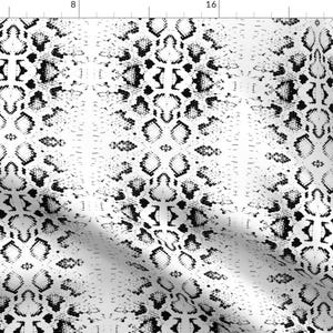 May include: Black and white snake skin pattern. The pattern is a repeating design of scales.