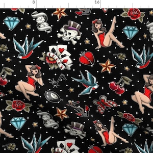 May include: A black and white polka dot background with a repeating pattern of traditional tattoo flash designs. The designs include a pin-up girl, a swallow, a cherry, a heart, a star, a dice, a playing card, an anchor, a butterfly, and a skull.