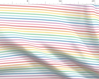 May include: A white fabric with thin, colourful stripes in a rainbow pattern. The stripes are pastel shades of red, orange, yellow, green, blue, indigo, and violet.