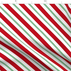 May include: Red and green diagonal stripes on a white background. The stripes are reminiscent of a candy cane.
