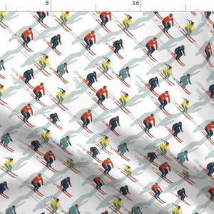 May include: A white background with a repeating pattern of skiers in red, blue, and yellow clothing. The skiers are all in a downhill position with their skis pointed down. The pattern is a fun and festive design that would be perfect for a winter-themed project.