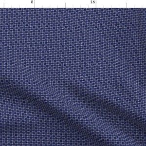 May include: A navy blue fabric with a white repeating pattern of small circles and lines. The fabric has a subtle texture and a slight sheen.