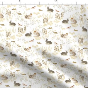 May include: A seamless pattern featuring a white background with brown rabbits, birds, and foliage. The pattern is perfect for fabric, wallpaper, or wrapping paper.