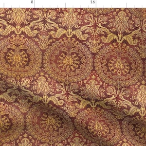 May include: A seamless pattern featuring a repeating design of intricate floral motifs in gold on a burgundy background. The pattern is reminiscent of traditional damask fabric.