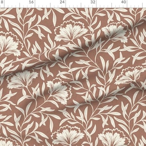 Peut inclure: Un motif sans couture avec des fleurs et des feuilles stylisées blanches sur un fond terracotta.