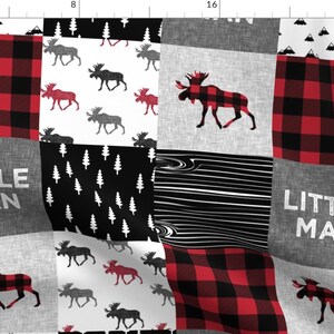 May include: A patchwork fabric design featuring a black and red buffalo plaid pattern, a black and white woodland pattern with trees, a gray and white pattern with moose, and the text "Little Man".
