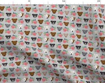 May include: A seamless pattern featuring a repeating design of grey, brown, and white pit bull dogs with pink floral accents on a light grey background.