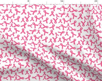 May include: A white background with a repeating pattern of pink ribbon symbols. The ribbons are all the same size and shape, and they are arranged in a random pattern.