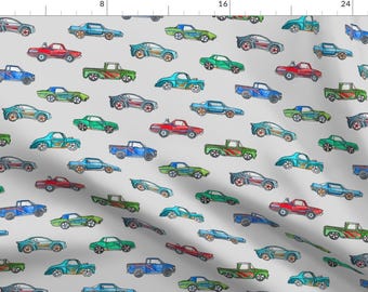 May include: A gray background with a repeating pattern of colorful toy cars. The cars are in various styles and colors, including red, blue, green, and yellow.