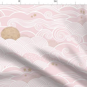 May include: A pink fabric with a white cloud pattern and gold stars. The clouds are in a variety of shapes and sizes, and the stars are scattered throughout the fabric.