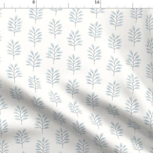 May include: A white fabric with a repeating pattern of light blue stylised branches. The branches are made up of thin lines and small leaves.