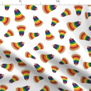 May include: A white background with a repeating pattern of rainbow-colored stacking rings. The rings are arranged in a cone shape, with the largest ring at the bottom and the smallest ring at the top. The rings are made of wood and have a smooth, polished finish.