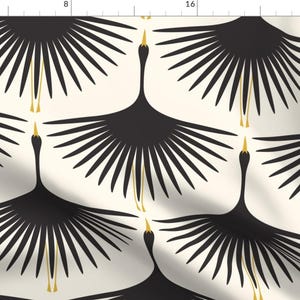 May include: A seamless pattern featuring black stylised cranes with gold accents on a cream background. The cranes are depicted with their wings spread wide, creating a symmetrical design.