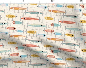 May include: A seamless pattern featuring colorful fishing lures on a cream background. The lures are in various shades of blue, yellow, red, and orange. Each lure has a propeller and a hook.