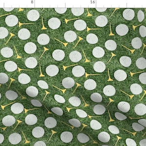May include: A seamless pattern featuring white golf balls on a green background with yellow golf tees.