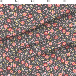 May include: A seamless pattern featuring pink pomegranates with yellow seeds on a dark gray background. The pomegranates are surrounded by delicate white and light blue floral vines.