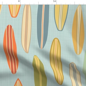 May include: A repeating pattern of colorful surfboard designs on a light blue background. The surfboards are in various shades of yellow, orange, green, and blue.