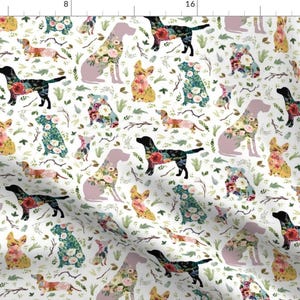 May include: A white background with a repeating pattern of various dog breeds, each outlined in black and filled with colorful floral designs. The dogs are in various poses, including sitting, standing, and running.