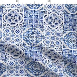 May include: Fabric with a repeating pattern of blue and white tiles. Each tile features a different ornate design, including floral and geometric shapes. The overall effect is reminiscent of traditional Portuguese or Mediterranean tilework.