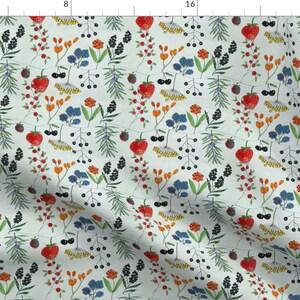 May include: A seamless pattern featuring a variety of red, orange, yellow, blue, and green floral elements on a light blue background. The pattern includes berries, leaves, and flowers.