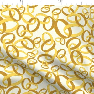 May include: A seamless pattern featuring overlapping gold rings on a white background. The rings are arranged in a random pattern, creating a modern and abstract design.