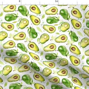 May include: A seamless pattern featuring watercolor illustrations of avocados on a white background. The avocados are depicted in various stages of ripeness, some whole and some sliced open, revealing their green flesh and brown seeds. The pattern is interspersed with green leaves and splatters of green paint.