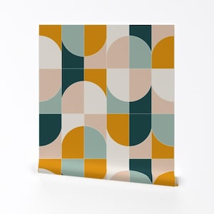 May include: A geometric pattern wallpaper with a repeating design of teal, mustard yellow, and pink half circles and squares.