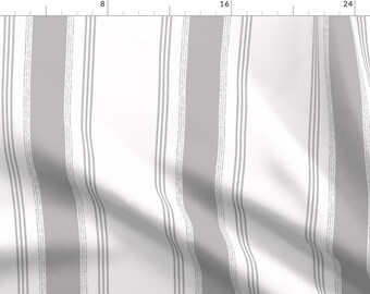 May include: White fabric with gray vertical stripes. The stripes are of varying widths and have a subtle textured pattern.