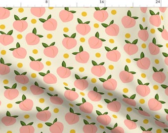 May include: A seamless pattern featuring pink peaches with green leaves on a cream background. The pattern is repeated throughout the image, with yellow dots scattered between the peaches.