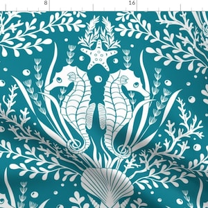 May include: Teal blue fabric with a white repeating pattern of seahorses, seashells, starfish, and seaweed.