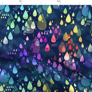 May include: A seamless fabric pattern featuring a repeating design of colorful raindrops on a dark blue background. The raindrops are in a rainbow gradient, with shades of blue, green, yellow, orange, red, and purple. The pattern is perfect for creating unique and stylish projects.