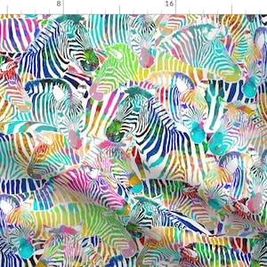 May include: A colorful pattern of zebras with rainbow stripes on a white background. The zebras are overlapping and create a busy, vibrant design.