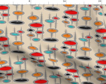 May include: A beige fabric with a repeating pattern of gray, red, orange, and blue abstract shapes. The shapes are circles, ovals, and lines. The pattern is reminiscent of mid-century modern design.