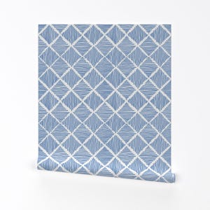 May include: A blue and white geometric patterned wallpaper with a diamond pattern. The wallpaper has a subtle texture and a modern design.