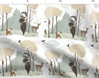 May include: A white background with a repeating pattern of brown bears, raccoons, deer, and squirrels in a forest setting. The animals are surrounded by trees with brown and white trunks and green leaves. The background is a light blue color.