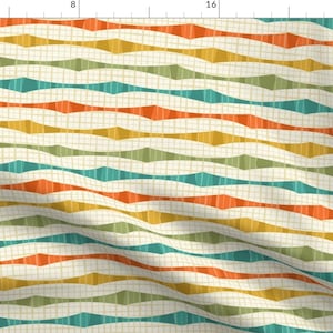 May include: Fabric with a repeating pattern of horizontal, wavy lines in shades of orange, teal, green, and yellow on a cream-colored background. The lines have a geometric, mid-century modern design.