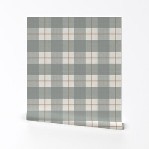 May include: A roll of wallpaper with a gray and beige plaid pattern.