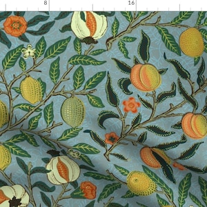May include: A fabric pattern featuring a light blue background with a repeating botanical design of yellow lemons, orange peaches, and white pomegranate-like fruits, interspersed with dark green leaves and small orange flowers.